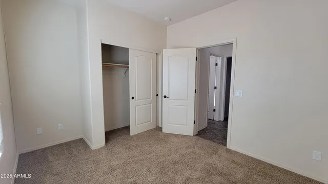 a view of room with a hallway