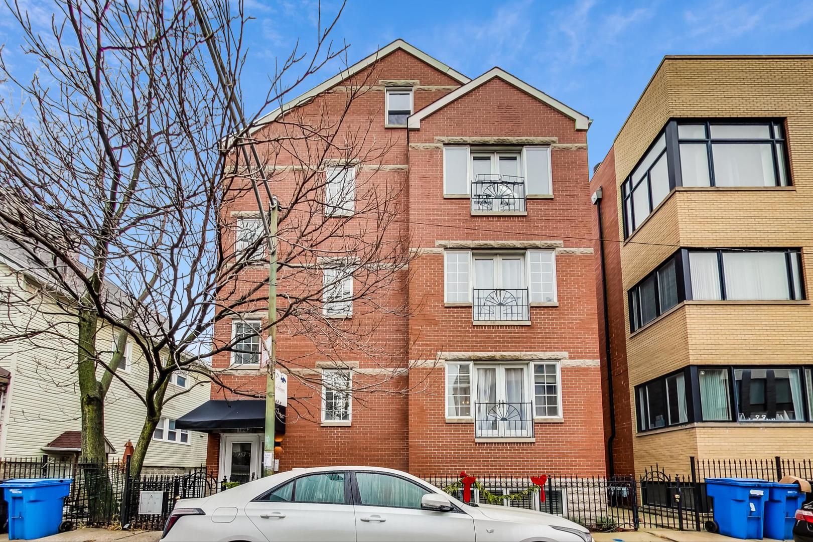 1532 West Fry Street, Unit 1 Chicago, IL 60642 - Photo 1 of 34 a front view of residential houses
