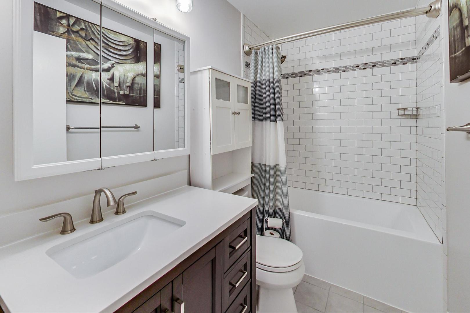1532 West Fry Street, Unit 1 Chicago, IL 60642 - Photo 13 of 34 a bathroom with a sink toilet and shower