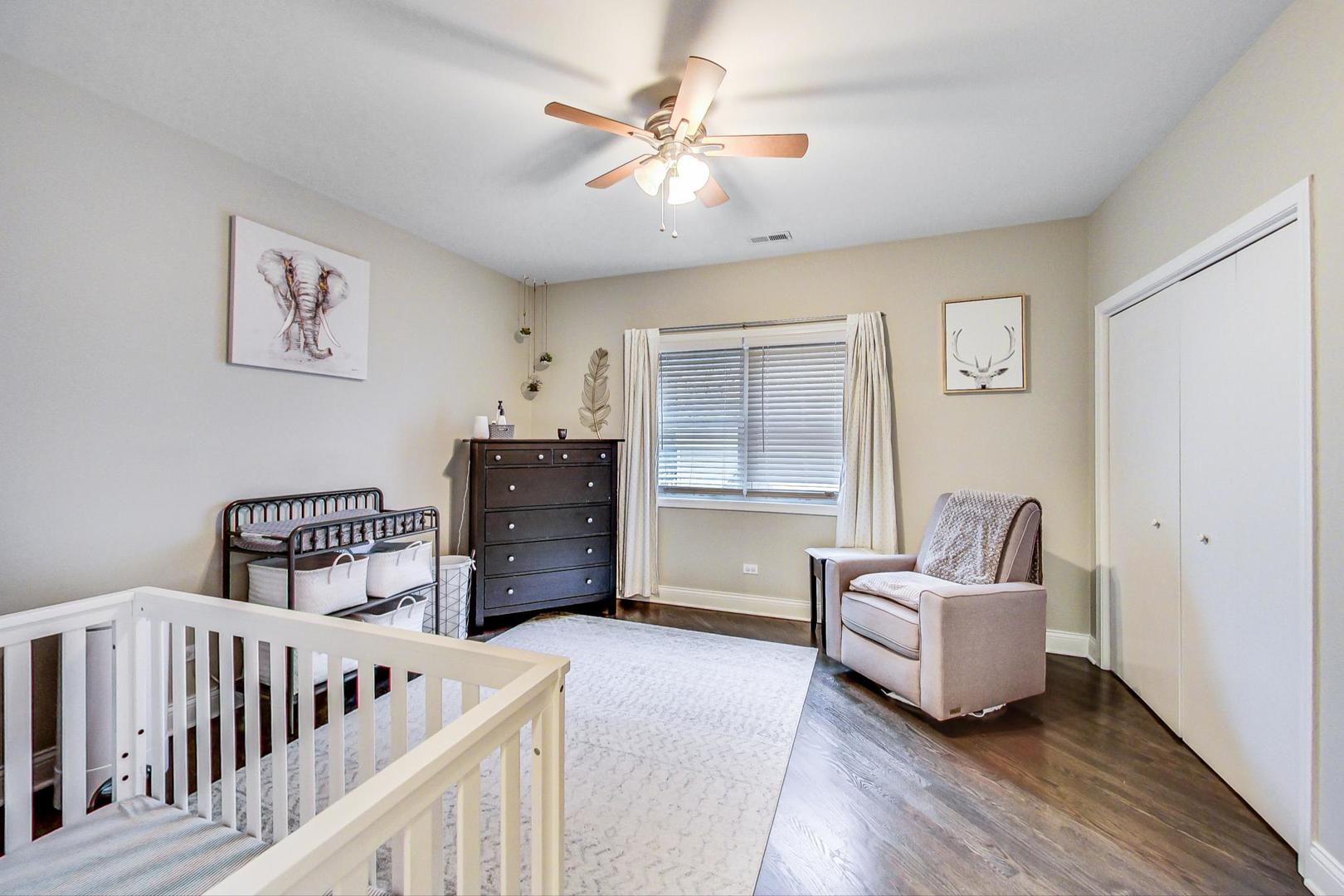 1532 West Fry Street, Unit 1 Chicago, IL 60642 - Photo 14 of 34 a bedroom with furniture and wooden floor
