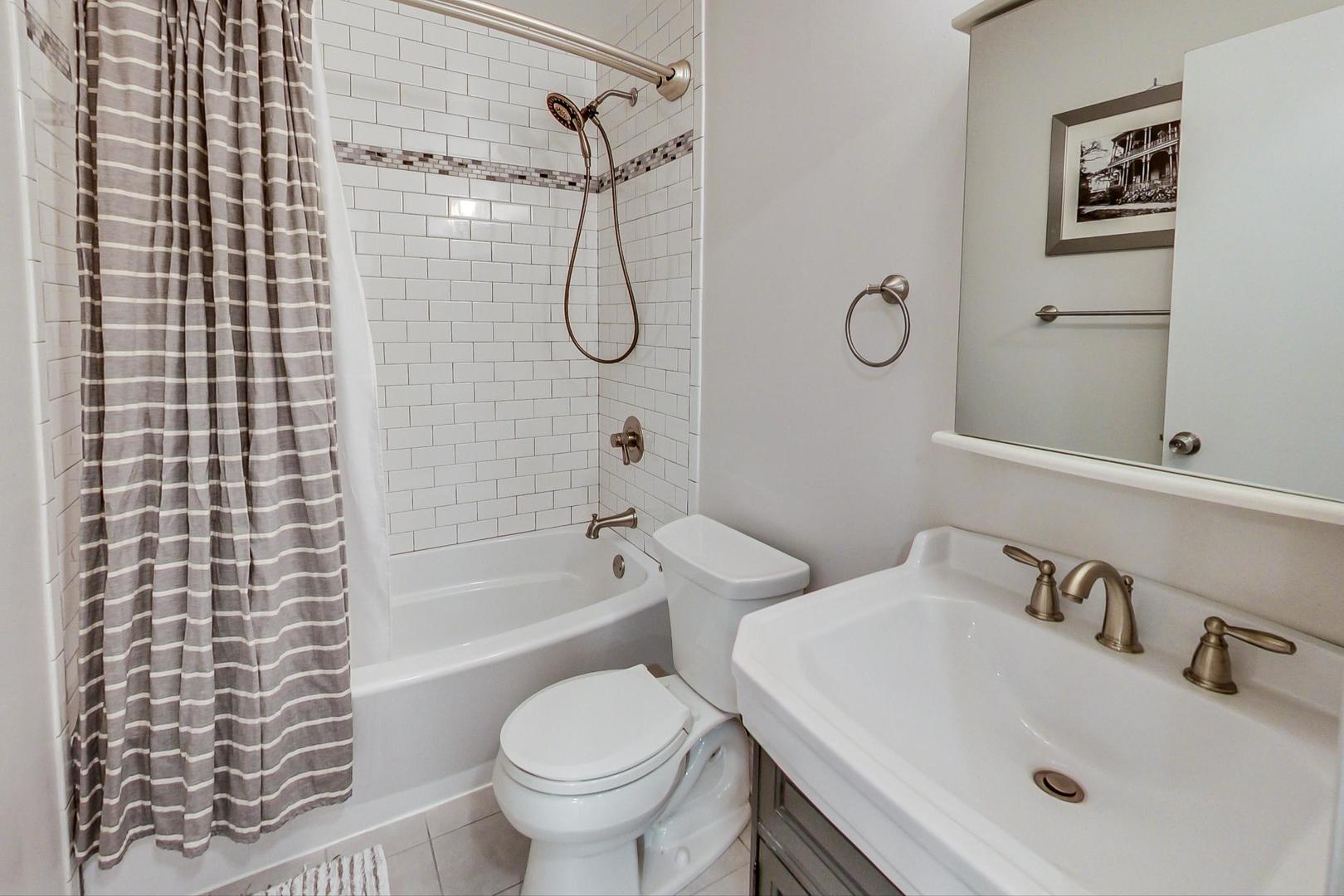 1532 West Fry Street, Unit 1 Chicago, IL 60642 - Photo 17 of 34 a bathroom with a sink toilet and shower
