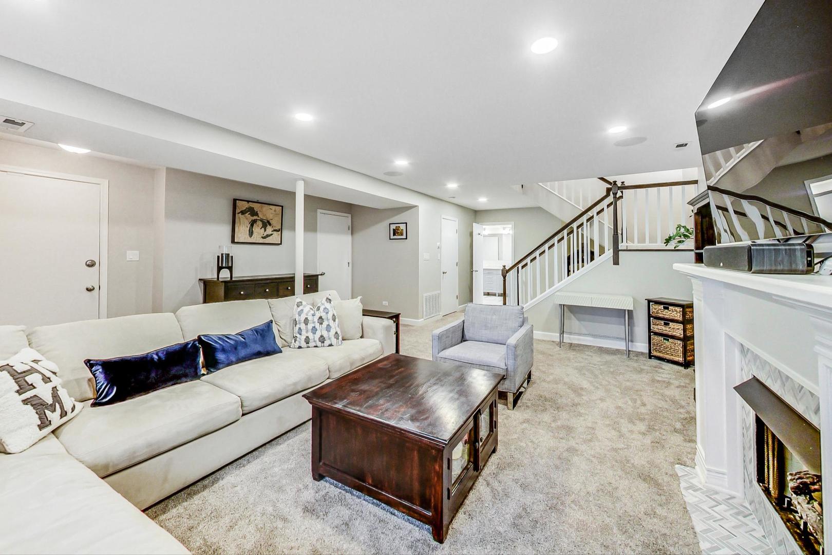 1532 West Fry Street, Unit 1 Chicago, IL 60642 - Photo 20 of 34 a living room with furniture and a fireplace