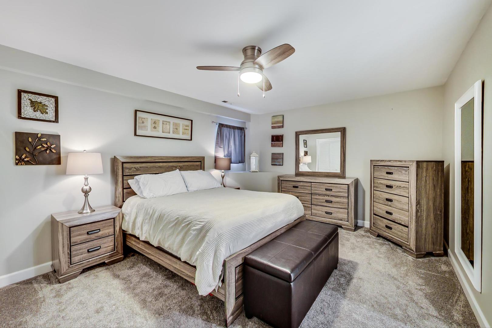 1532 West Fry Street, Unit 1 Chicago, IL 60642 - Photo 21 of 34 a bedroom with a bed and a tv