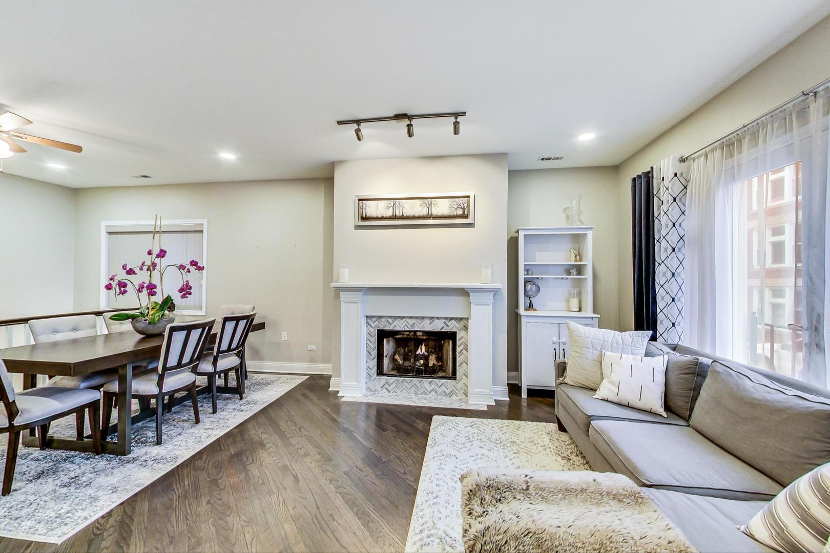 1532 West Fry Street, Unit 1 Chicago, IL 60642 - Photo 5 of 34 a living room with furniture fireplace and window