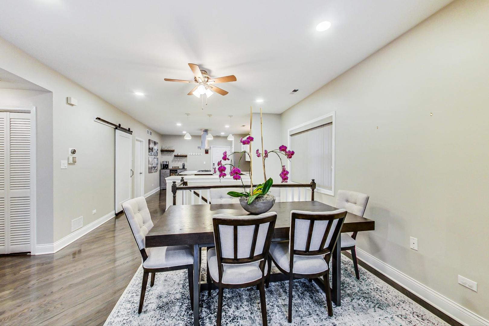 1532 West Fry Street, Unit 1 Chicago, IL 60642 - Photo 7 of 34 a view of a dining room with furniture and wooden floor