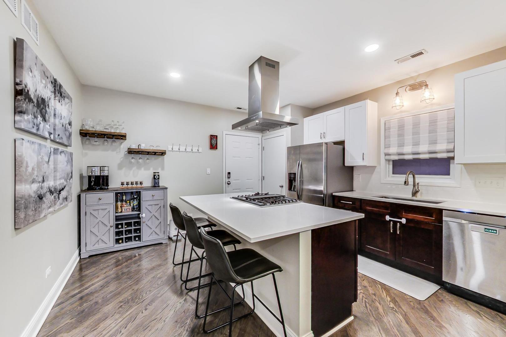 1532 West Fry Street, Unit 1 Chicago, IL 60642 - Photo 9 of 34 a kitchen with stainless steel appliances a stove a sink dishwasher and a refrigerator