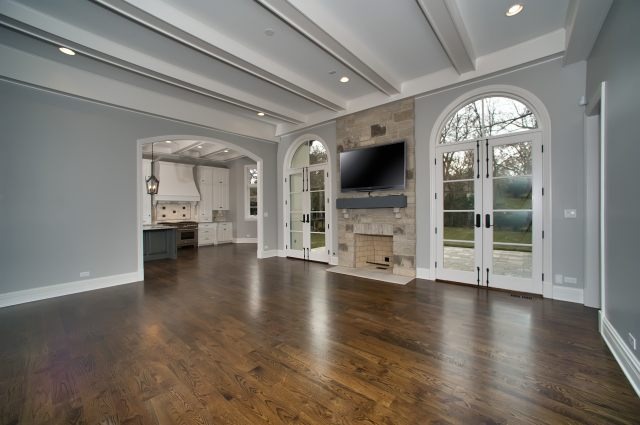344 Forest Road Hinsdale, IL 60521 - Photo 11 of 25 an empty room with wooden floor a fireplace and a window