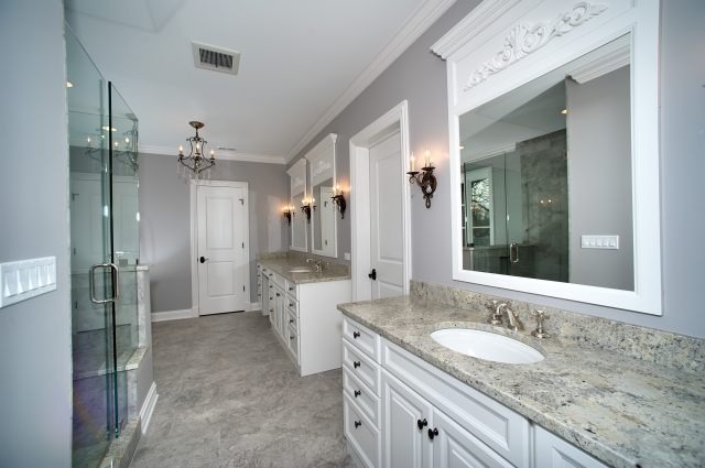 344 Forest Road Hinsdale, IL 60521 - Photo 17 of 25 a bathroom with a granite countertop sink mirror and a shower