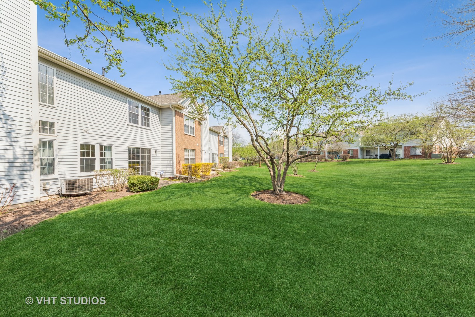 253 Hawk Court Schaumburg, IL 60193 - Photo 14 of 15 a view of a house with a backyard
