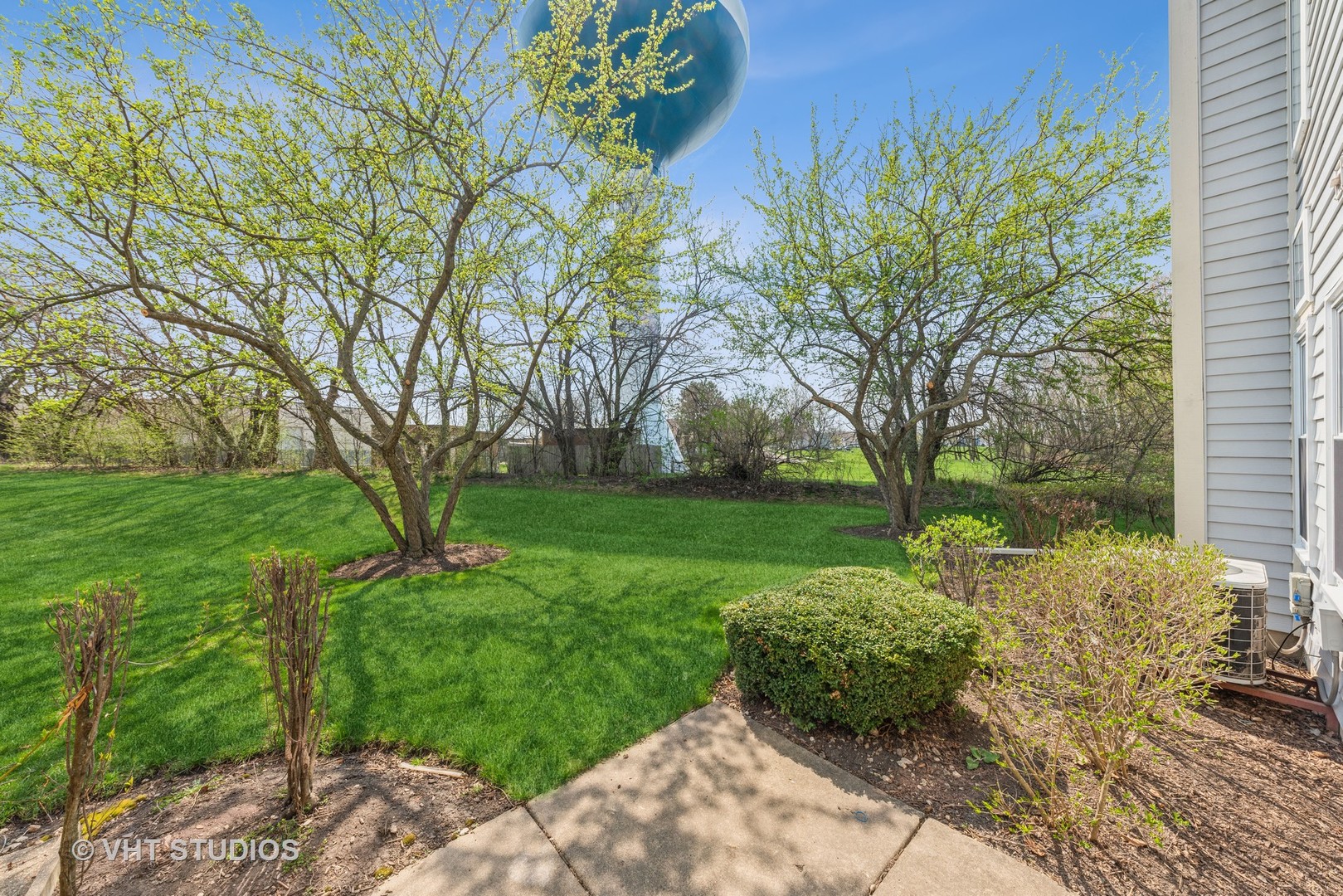 253 Hawk Court Schaumburg, IL 60193 - Photo 15 of 15 a view of a garden with a tree