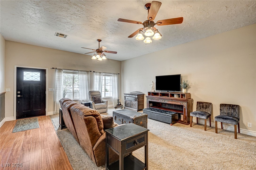 1140 Mahoney Avenue Logandale, NV 89021 - Photo 13 of 51 Living room with a textured ceiling and ceiling fan