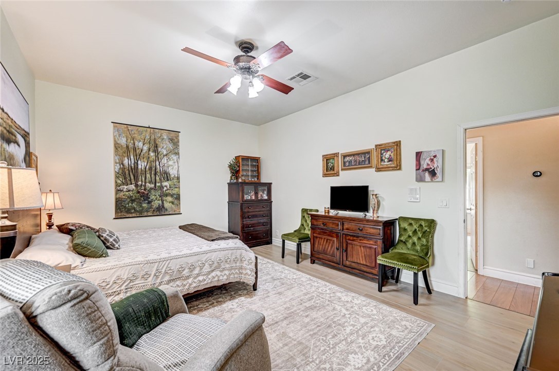 1140 Mahoney Avenue Logandale, NV 89021 - Photo 26 of 51 Bedroom featuring light wood finished floors and a ceiling fan