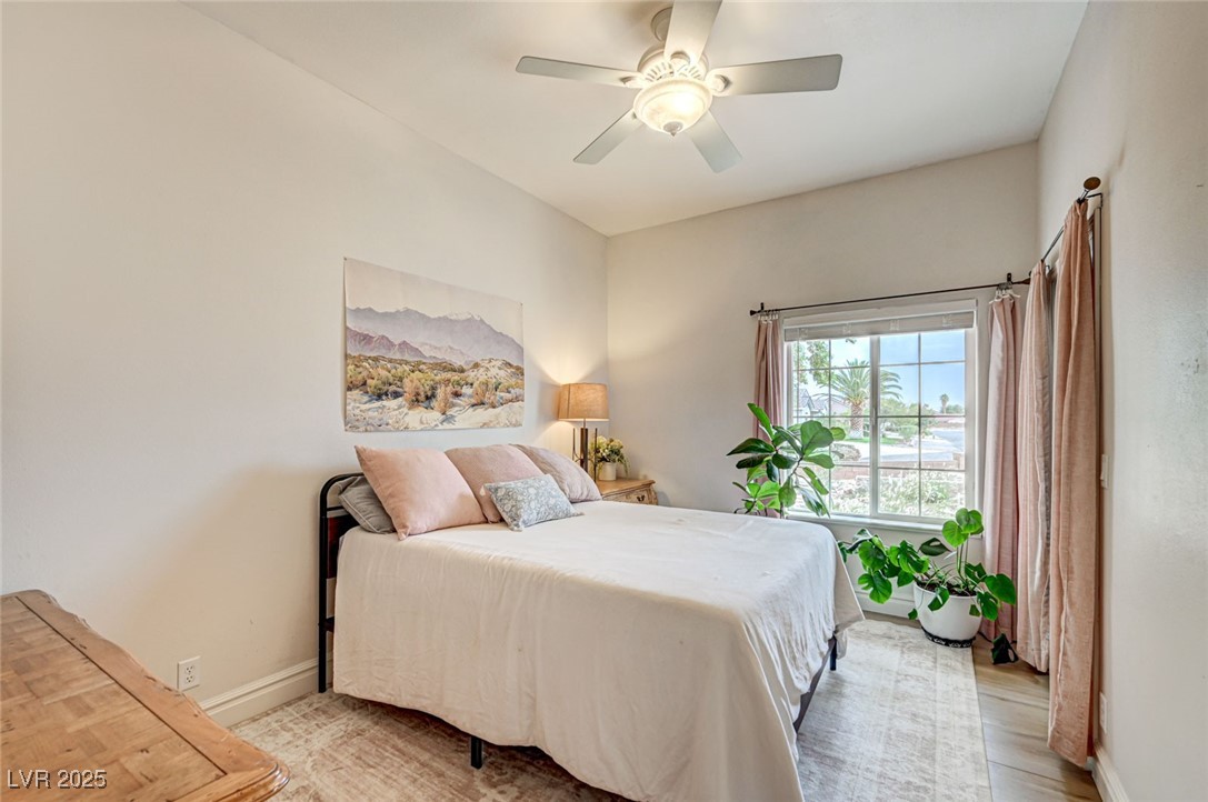 1140 Mahoney Avenue Logandale, NV 89021 - Photo 30 of 51 Bedroom featuring ceiling fan and light wood-type flooring