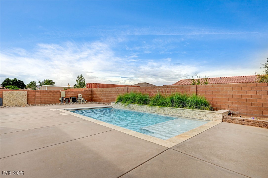 1140 Mahoney Avenue Logandale, NV 89021 - Photo 4 of 51 View of pool featuring a fenced backyard and a patio