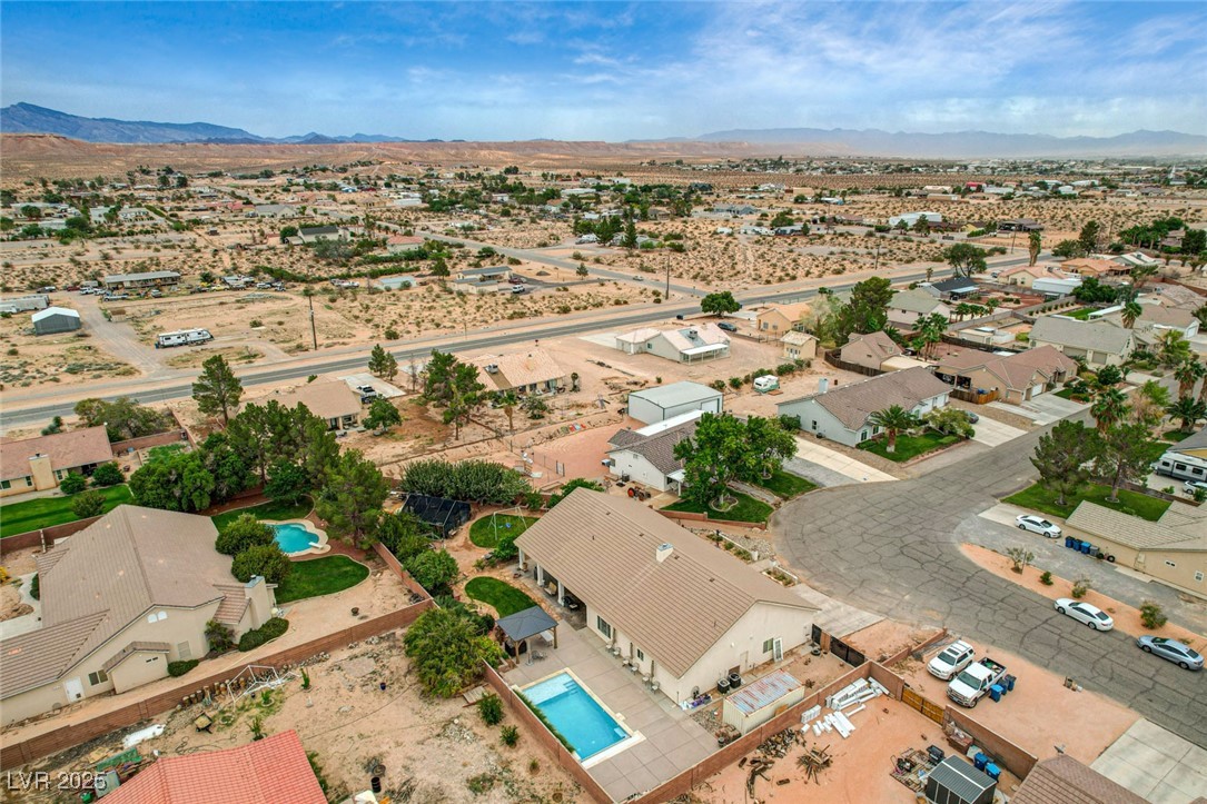 1140 Mahoney Avenue Logandale, NV 89021 - Photo 50 of 51 Aerial view of sparsely populated area featuring a desert landscape and nearby suburban area