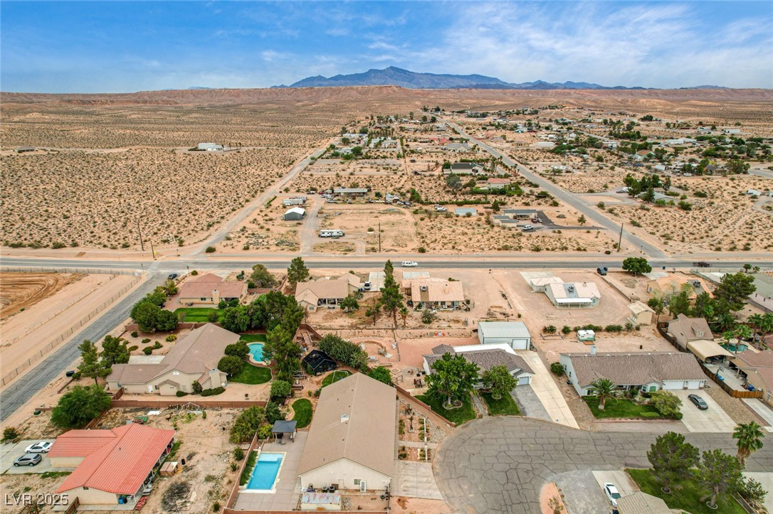 1140 Mahoney Avenue Logandale, NV 89021 - Photo 51 of 51 Aerial view of property and surrounding area with rural landscape and nearby suburban area
