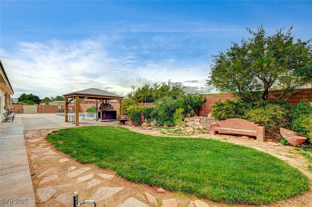 1140 Mahoney Avenue Logandale, NV 89021 - Photo 7 of 51 Fenced backyard featuring a gazebo and a patio area