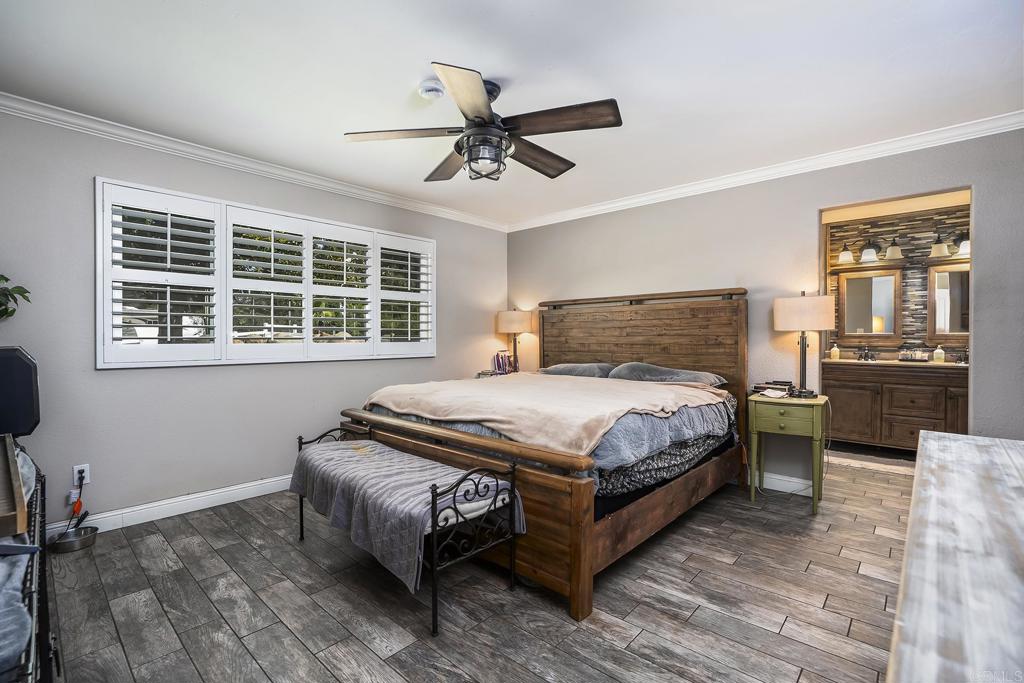 2430 Geyer Lane Alpine, CA 91901 - Photo 20 of 60 a bedroom with a bed and wooden floor