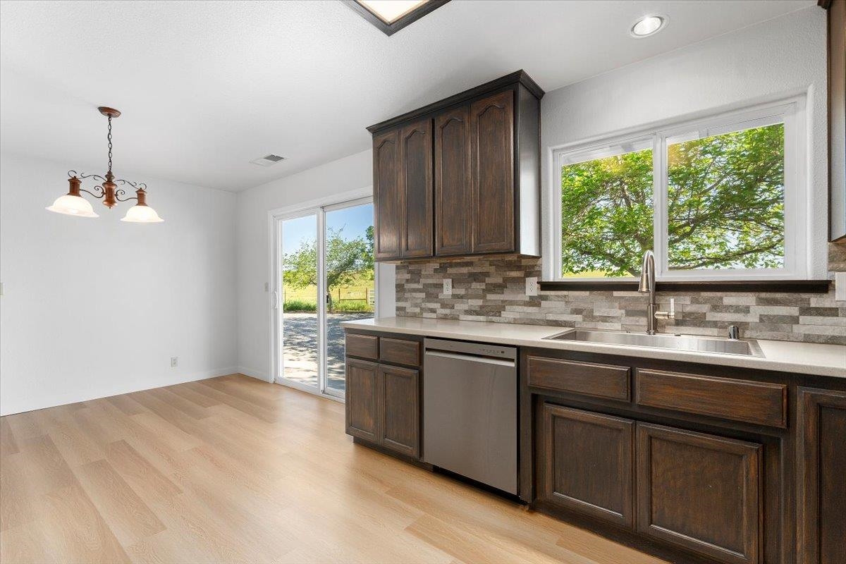 18476 Paskenta Road Corning, CA 96021 - Photo 10 of 57 a kitchen with a sink and large window