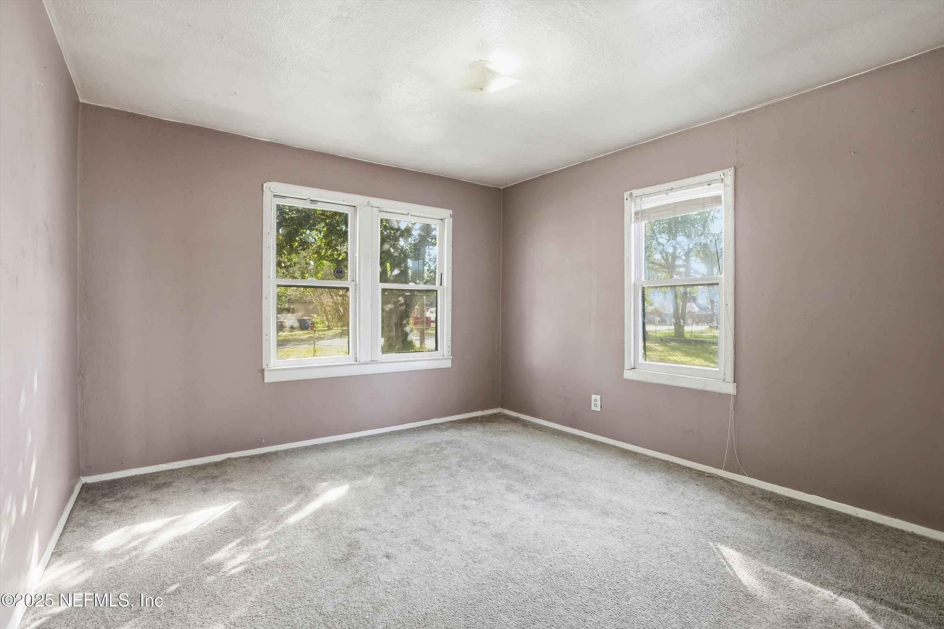 11558 Raft Road Jacksonville, FL 32218 - Photo 30 of 32 an empty room with windows