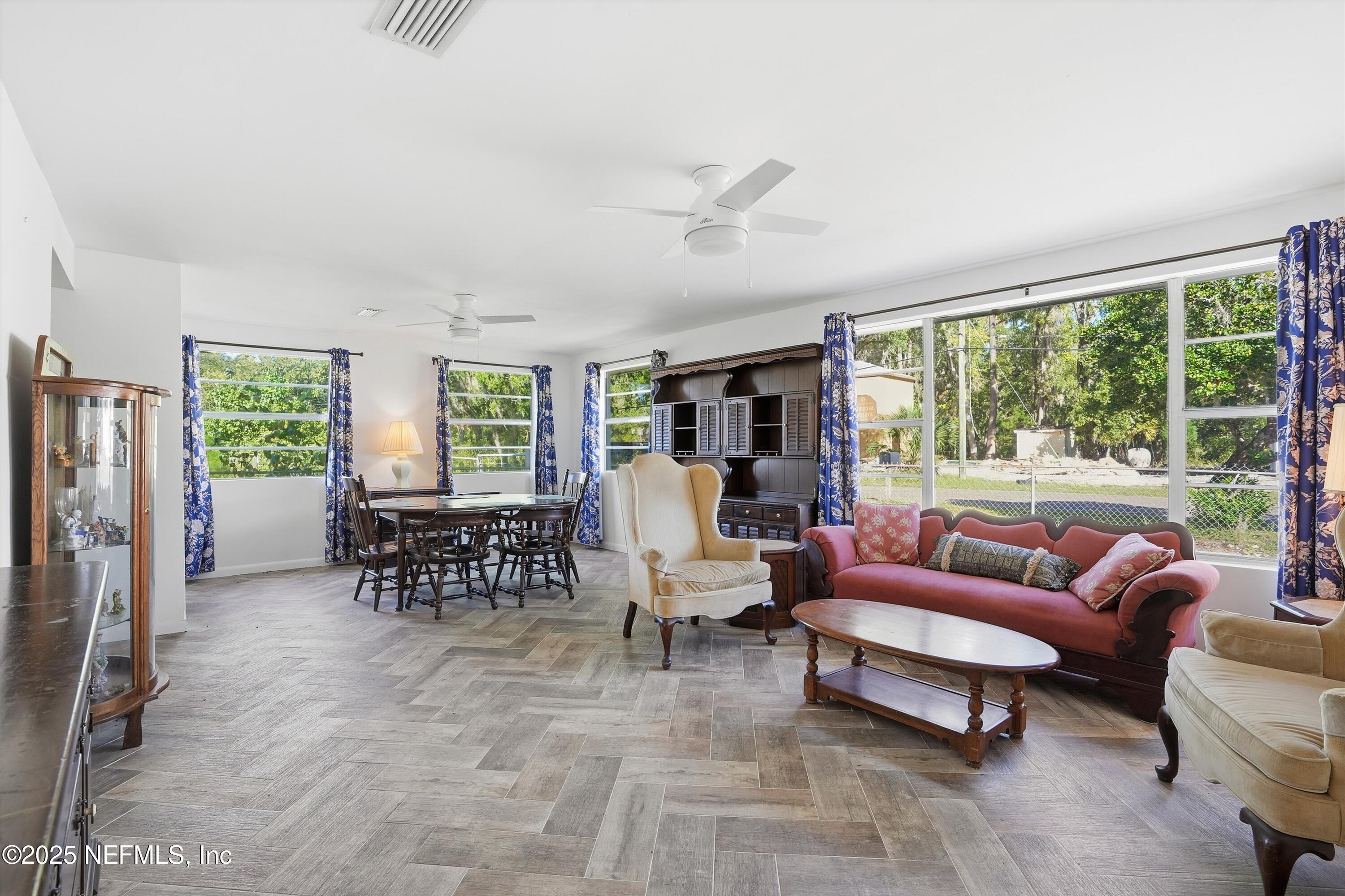 11558 Raft Road Jacksonville, FL 32218 - Photo 6 of 32 a living room with furniture and a large window
