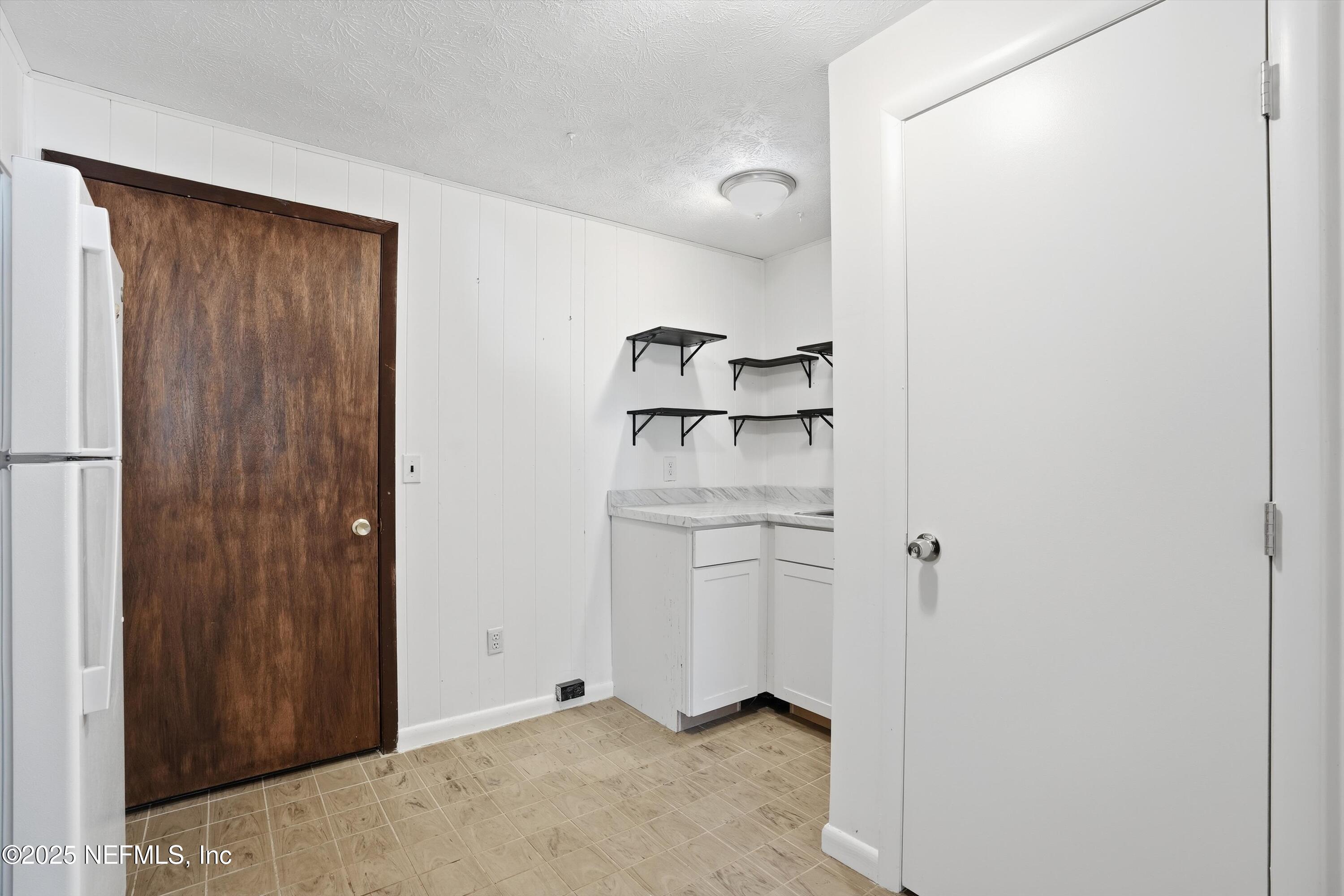 11558 Raft Road Jacksonville, FL 32218 - Photo 9 of 32 a view of walk in closet with cabinet