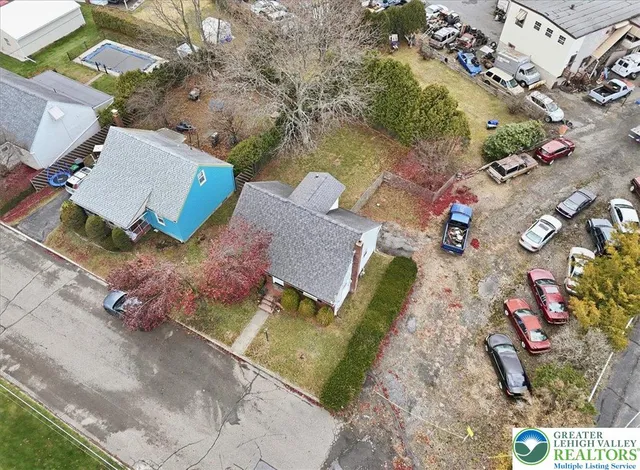an aerial view of a house with outdoor space