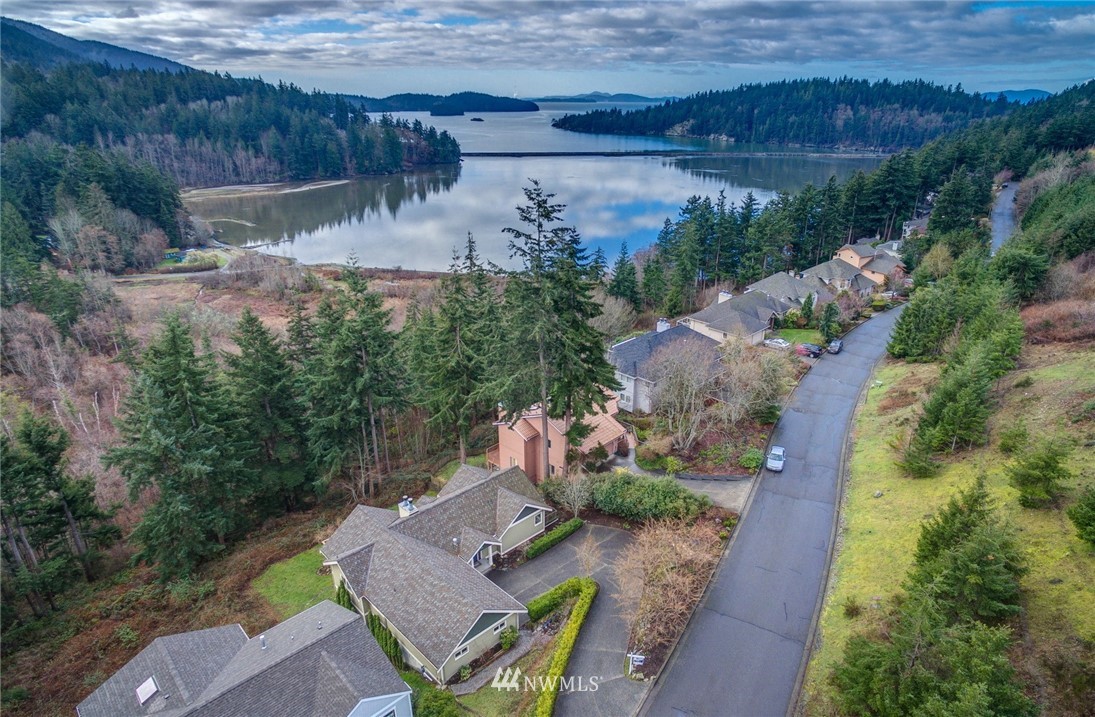 208 Sea Pines Road Bellingham, WA 98229 - Photo 1 of 34 an aerial view of a house with a yard and lake view