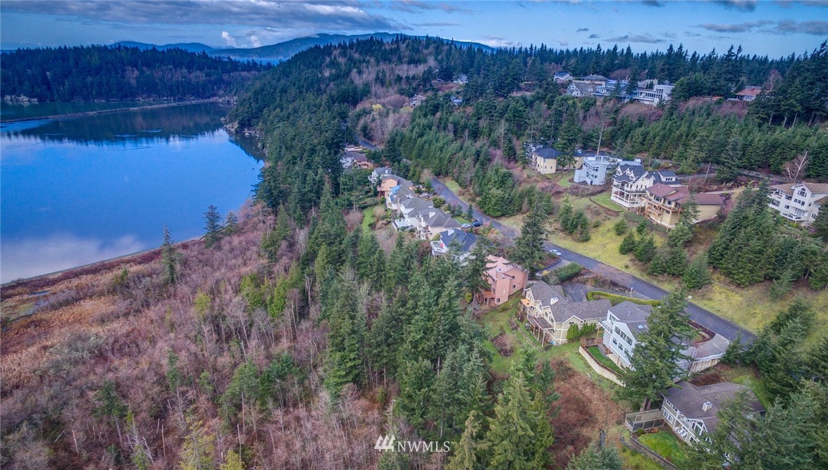 208 Sea Pines Road Bellingham, WA 98229 - Photo 2 of 34 a view of a lake with a yard
