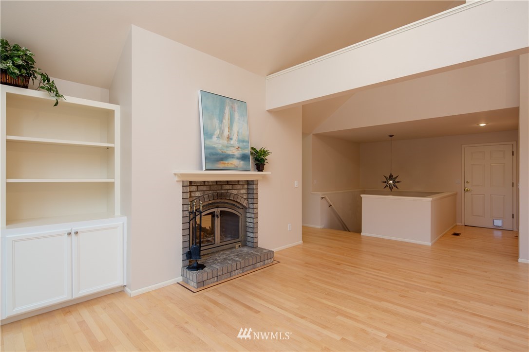 208 Sea Pines Road Bellingham, WA 98229 - Photo 16 of 34 a living room with furniture and a fireplace