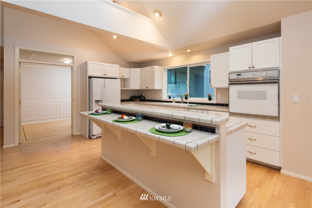 208 Sea Pines Road Bellingham, WA 98229 - Photo 18 of 34 a kitchen with stainless steel appliances granite countertop a sink stove and refrigerator