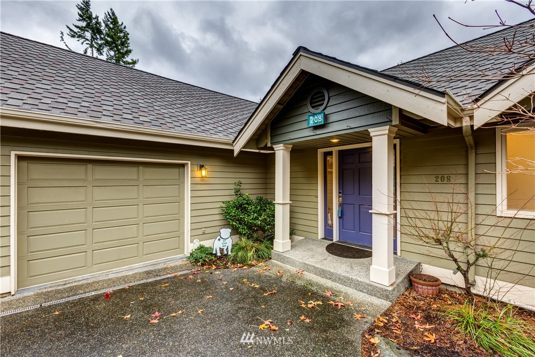 208 Sea Pines Road Bellingham, WA 98229 - Photo 3 of 34 a front view of a house with garden