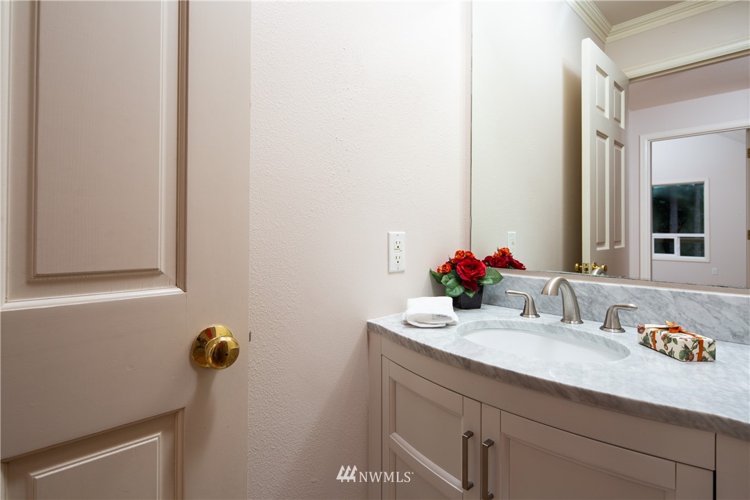 208 Sea Pines Road Bellingham, WA 98229 - Photo 22 of 34 a bathroom with a sink vanity and a mirror
