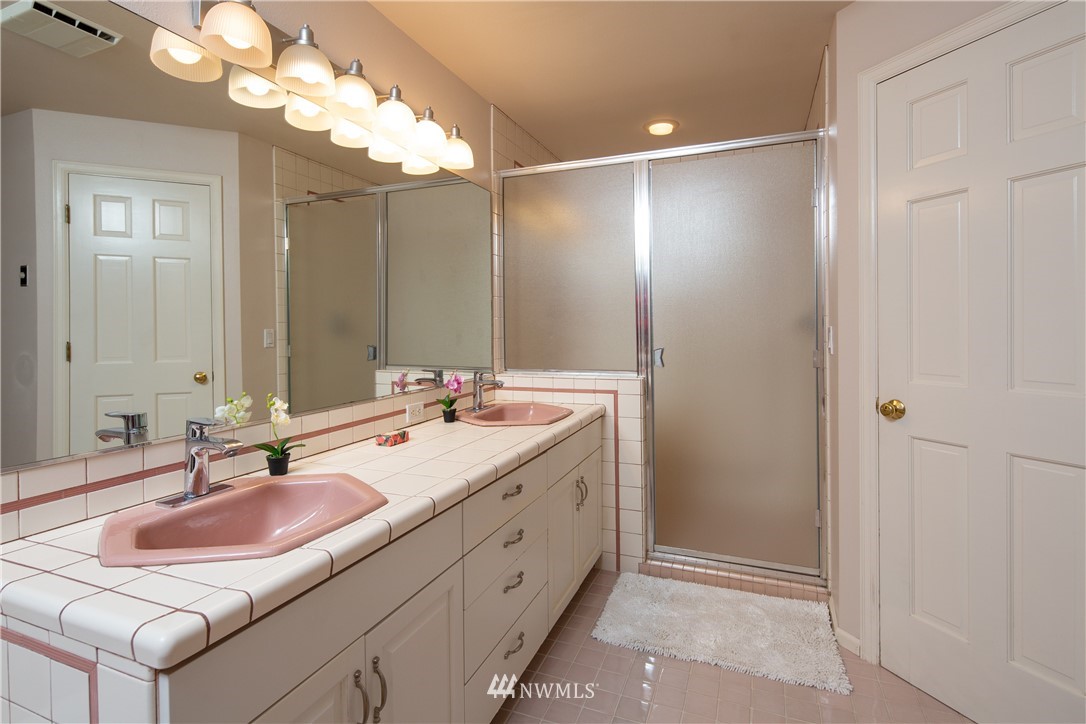 208 Sea Pines Road Bellingham, WA 98229 - Photo 25 of 34 a bathroom with a double vanity sink and a mirror
