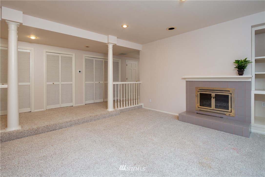 208 Sea Pines Road Bellingham, WA 98229 - Photo 27 of 34 a view of an empty room with a fireplace