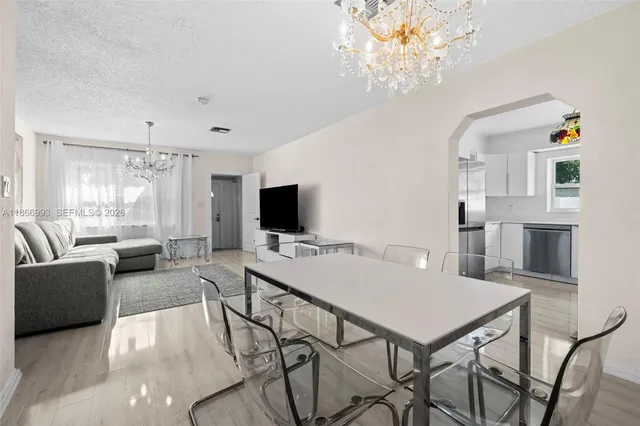 a bathroom with a granite countertop toilet sink and mirror