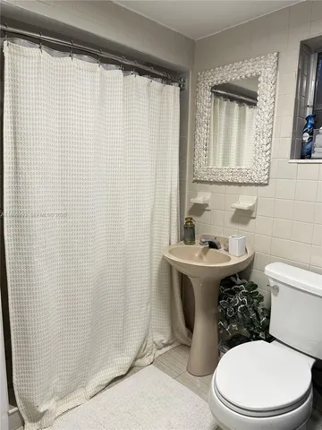 a living room with furniture fireplace and flat screen tv