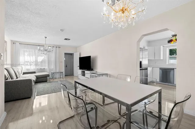 a bathroom with a granite countertop toilet sink and mirror