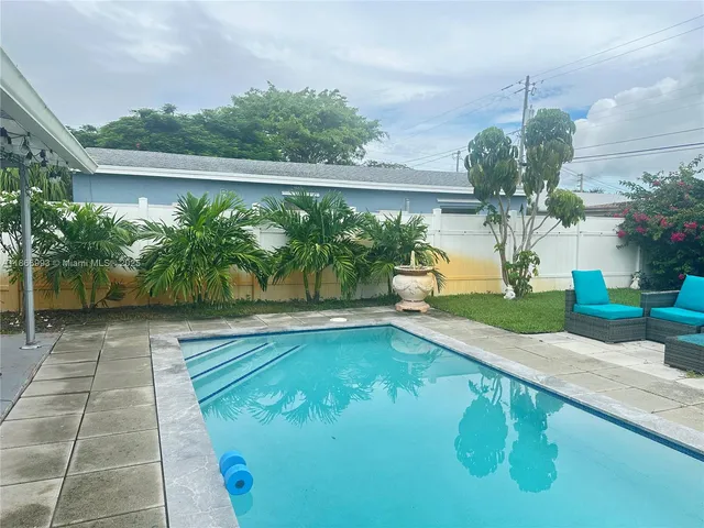 a view of a swimming pool with a patio