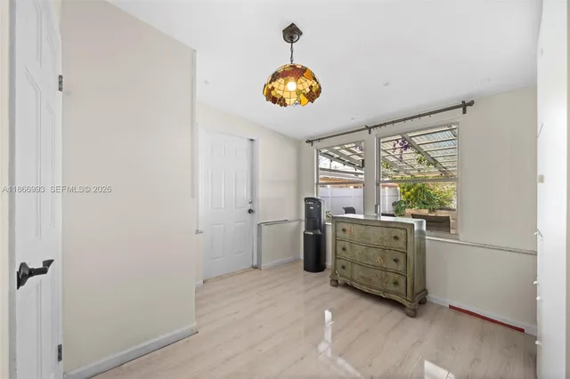 a room with window and cabinets