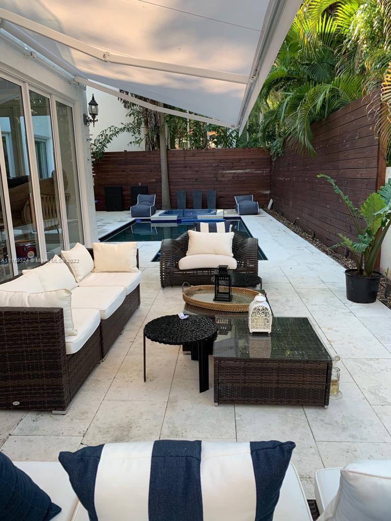 1830 Chucunantah Road Miami, FL 33133 - Photo 3 of 8 a outdoor space with patio couch and a potted plant