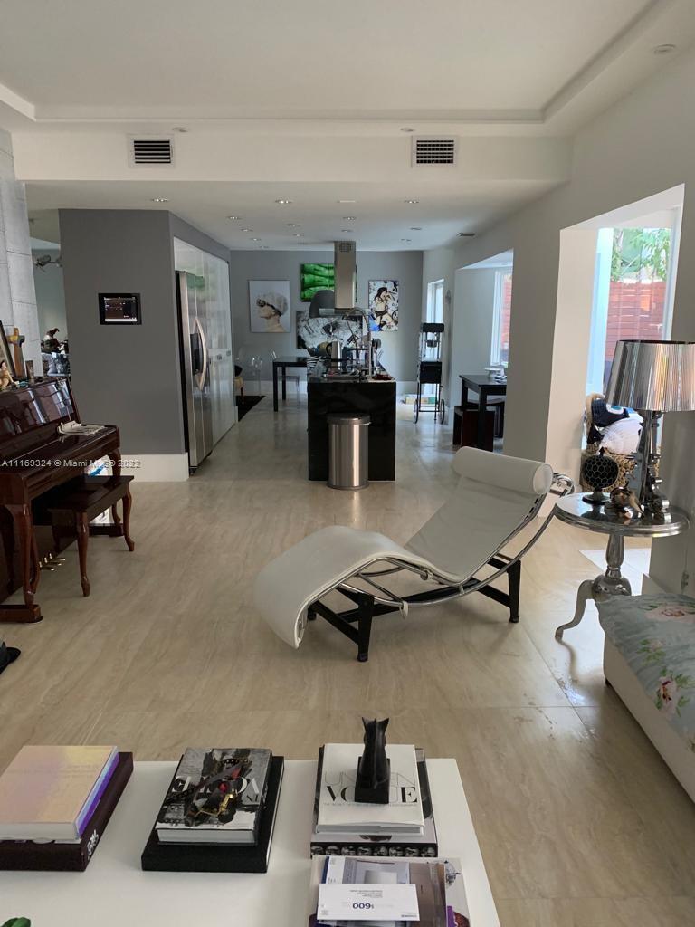 1830 Chucunantah Road Miami, FL 33133 - Photo 4 of 8 a room with furniture and a flat screen tv