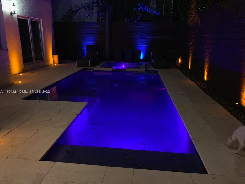 1830 Chucunantah Road Miami, FL 33133 - Photo 7 of 8 a room with pool table and a fireplace