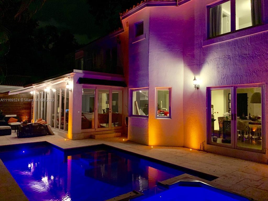 1830 Chucunantah Road Miami, FL 33133 - Photo 8 of 8 a view of a house with a barbeque grill and potted plants