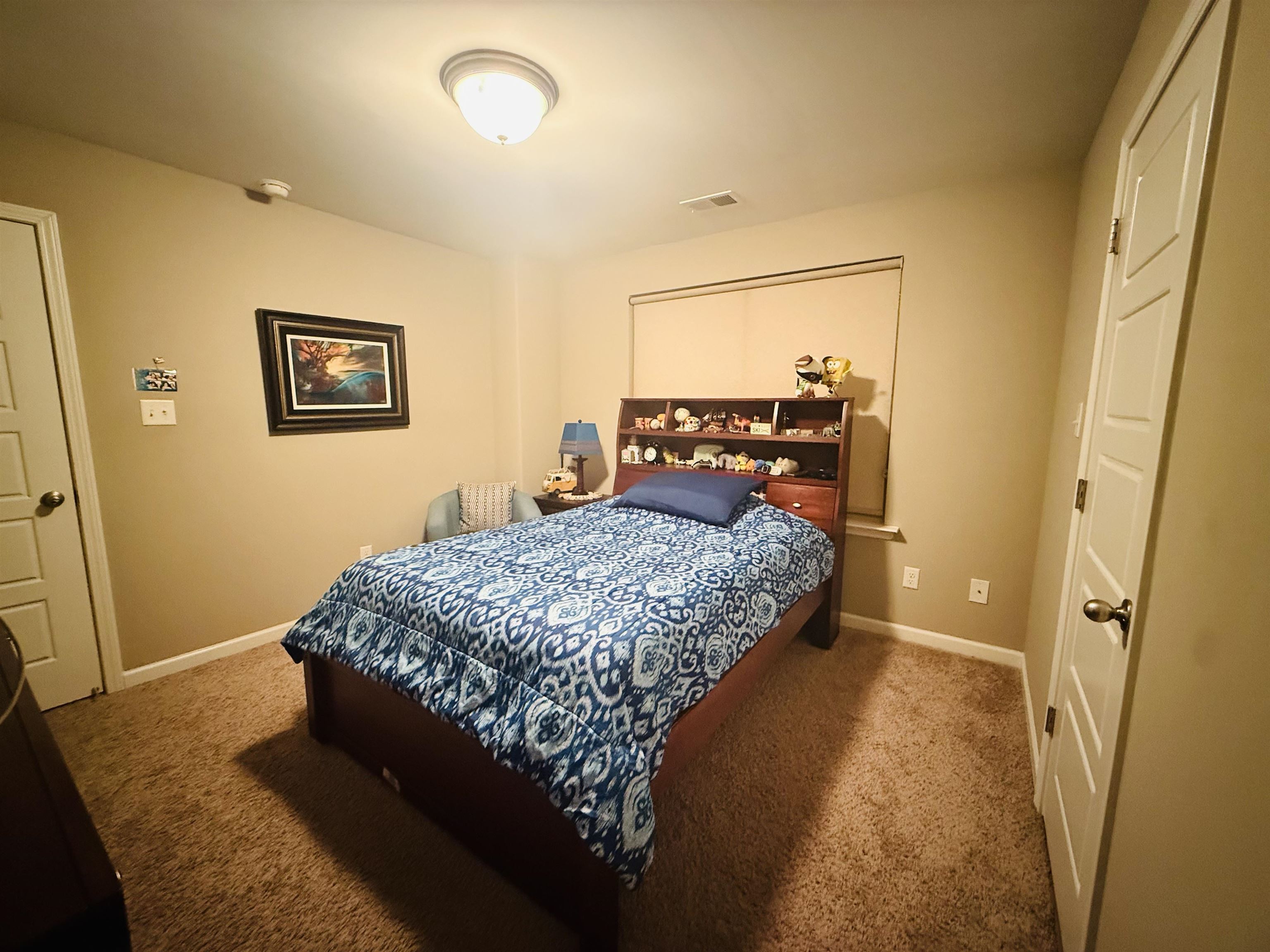 8443 Butterfly View Lane Bartlett, TN 38133 - Photo 9 of 12 a bedroom with a bed and a table