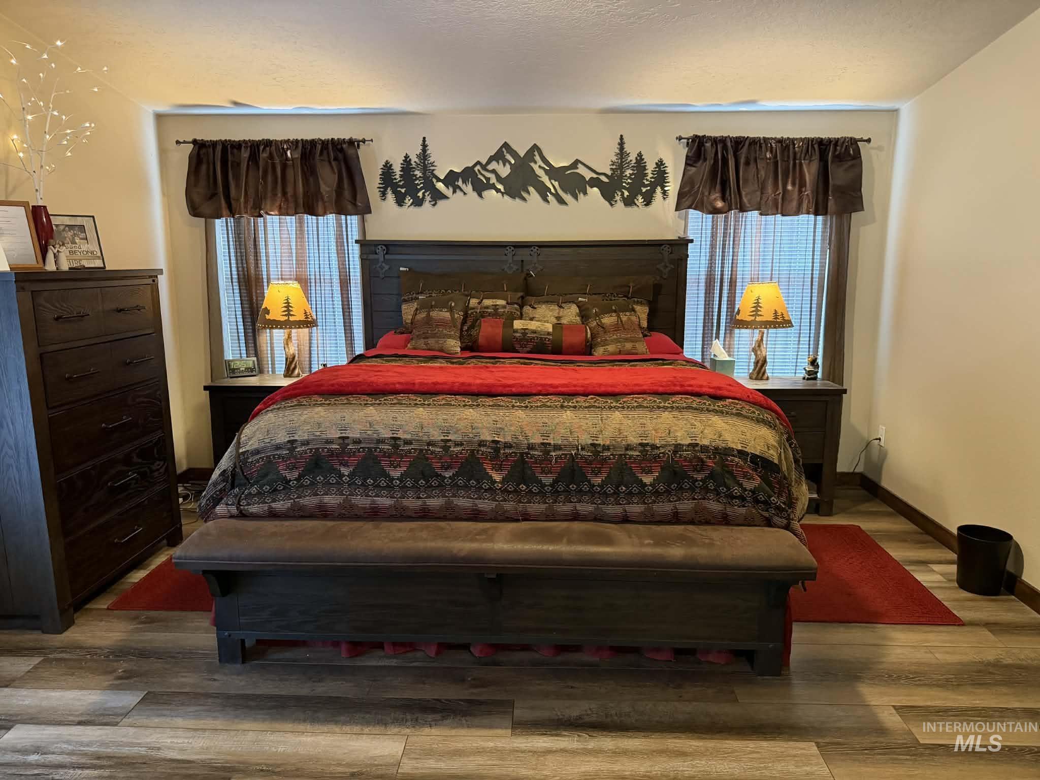 19378 Homestead Loop Lewiston, ID 83501 - Photo 14 of 42 Bedroom featuring wood finished floors and multiple windows