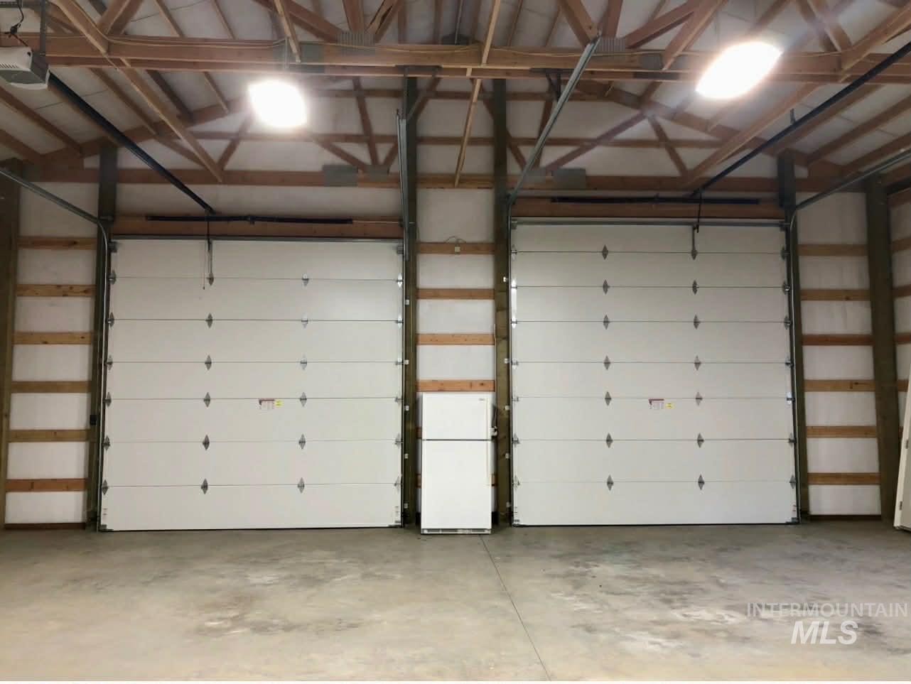 19378 Homestead Loop Lewiston, ID 83501 - Photo 41 of 42 Garage with freestanding refrigerator and a garage door opener