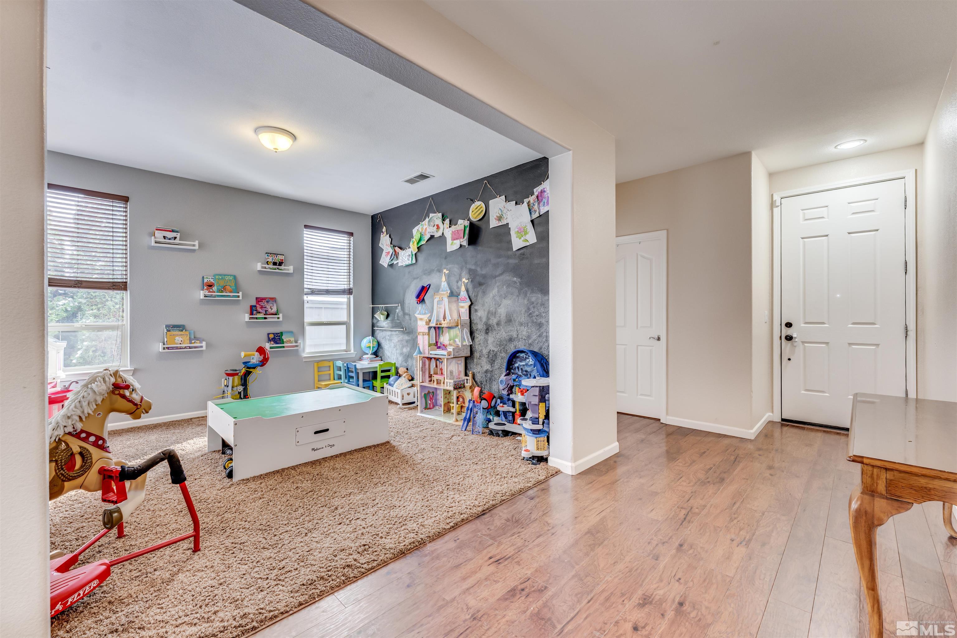 13810 Seabiscuit Drive Reno, NV 89521 - Photo 3 of 25 a living room with furniture and wooden floor