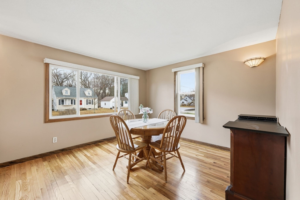 104 Chateaugay Street Chicopee, MA 01020 - Photo 11 of 38 a view of a dining room with furniture window and wooden floor