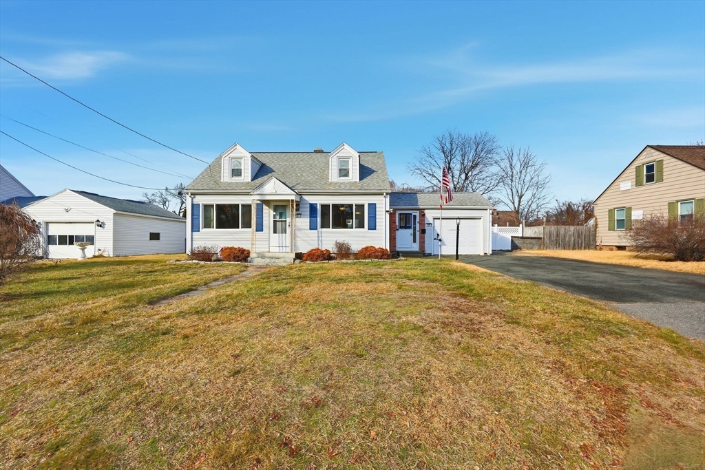 104 Chateaugay Street Chicopee, MA 01020 - Photo 2 of 38 a front view of a building with a big yard and large trees